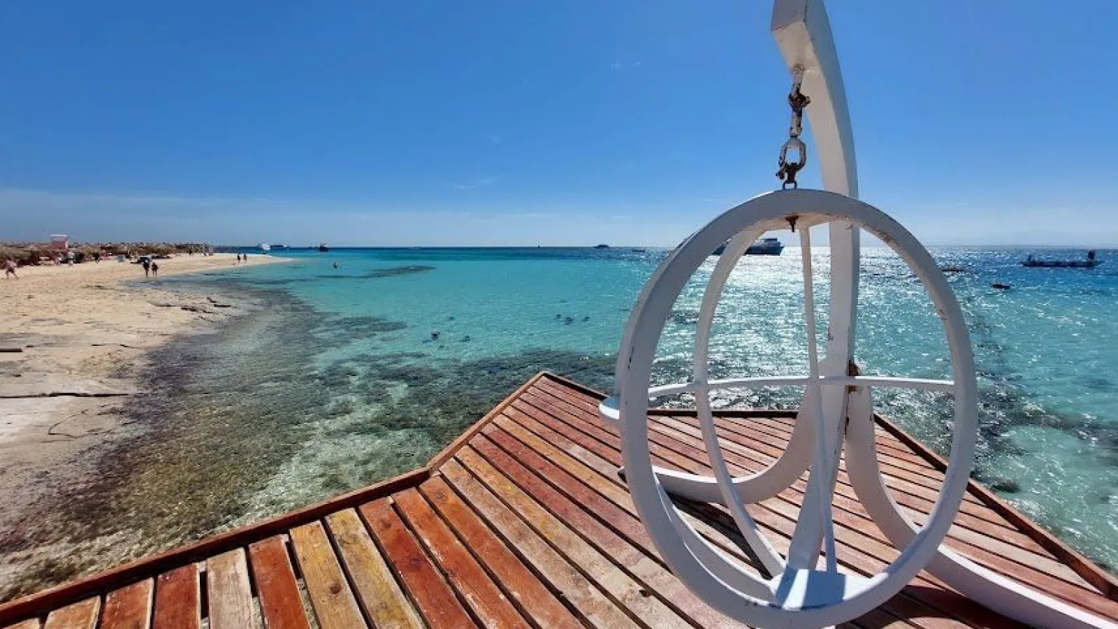 Wooden boat deck over the turquoise shallows of Paradise Island, Giftun, Hurghada