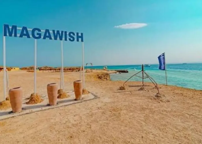 MAGAWISH letters sign with clay pots on the sandy beach of Magawish Island, Hurghada