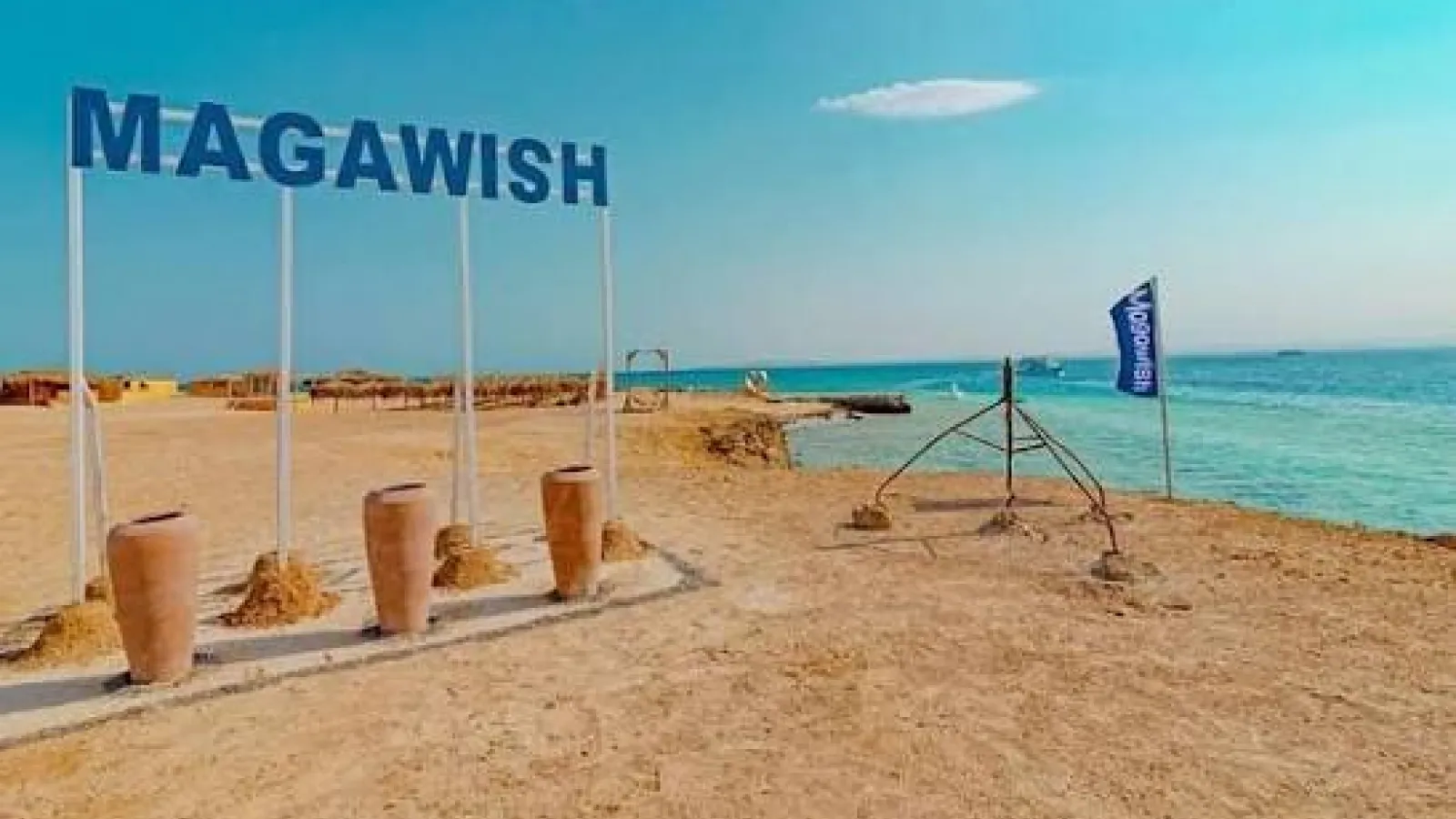 MAGAWISH letters sign with clay pots on the sandy beach of Magawish Island, Hurghada