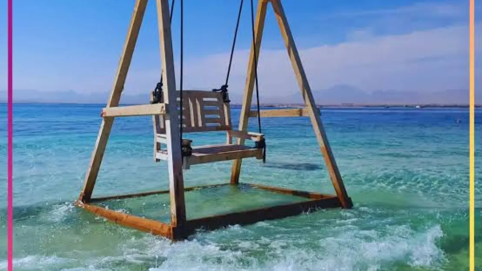 Wooden swing standing in the shallow turquoise sea off Magawish Island, Hurghada
